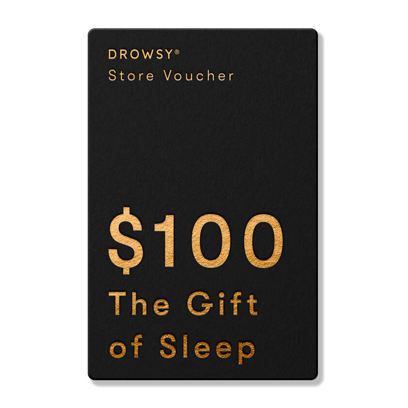 A black Drowsy Sleep Co. Gift Card with gold text—worth $100—makes the perfect online gift from us.drowsysleepco for anyone in need of restful sleep.