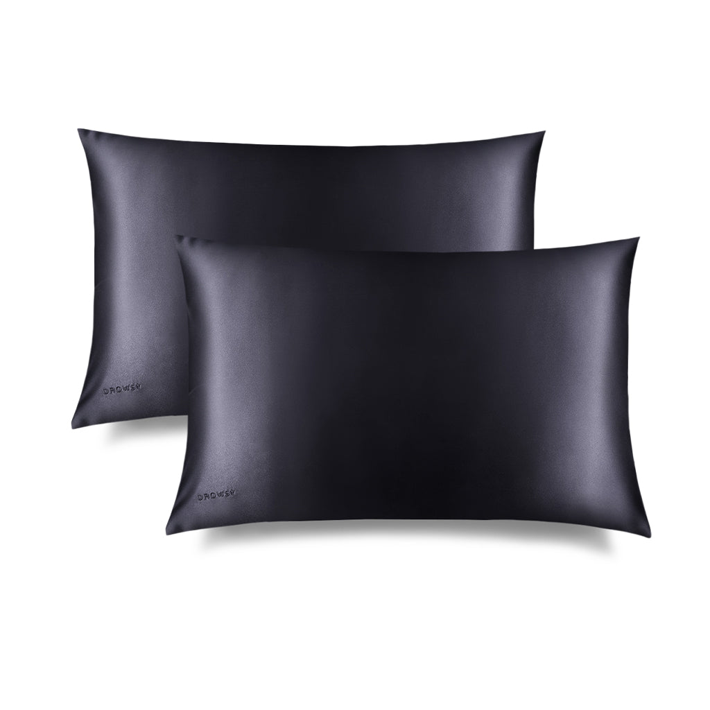 Two Moonlight Shadow Silk Pillowcases by us.drowsysleepco are shown overlapping on a white background, highlighting their smooth, shiny texture and benefits for hair and skin care.