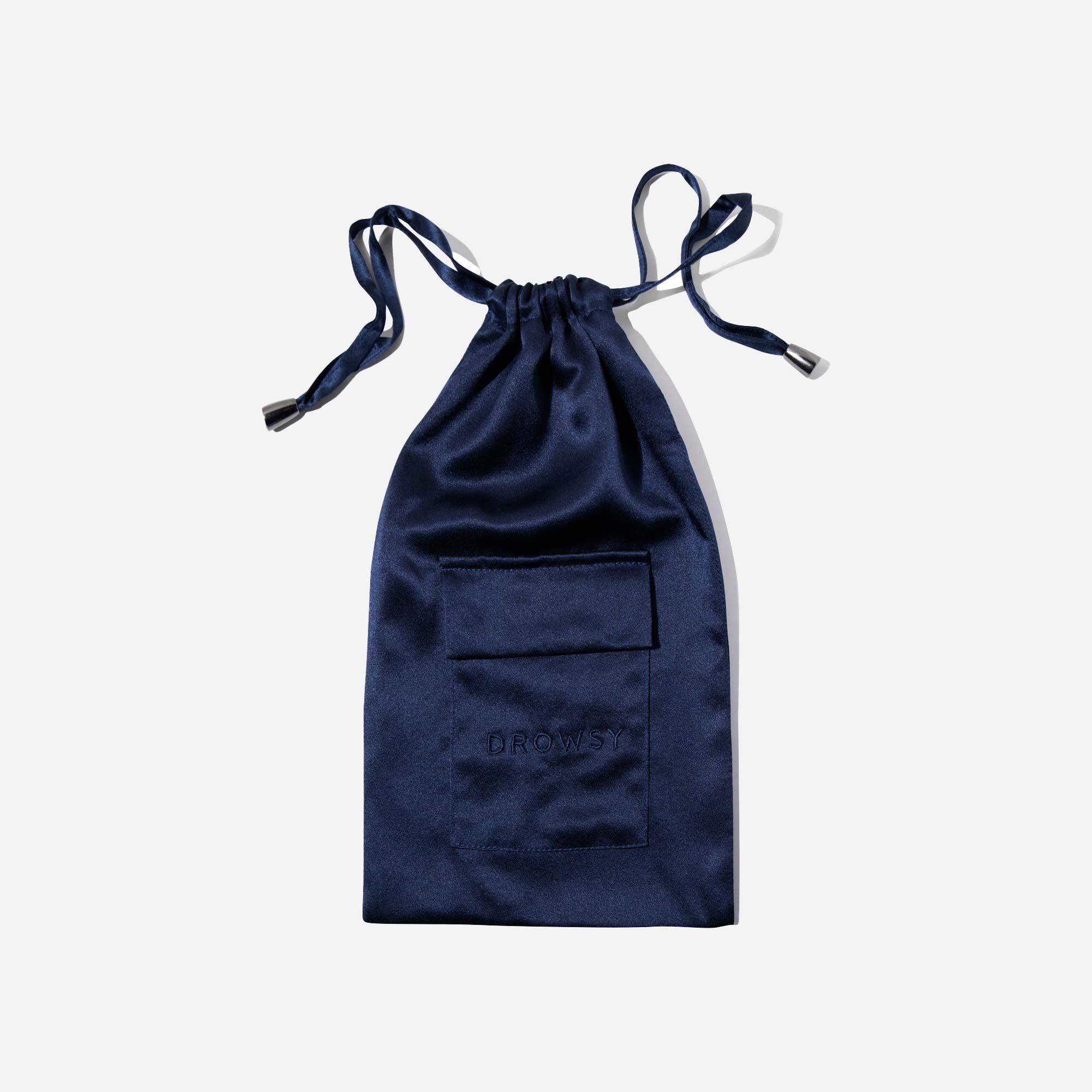 A navy blue satin drawstring pouch with a small front pocket and the word DROWSY subtly embossed on the pocket, displayed against a plain white background.