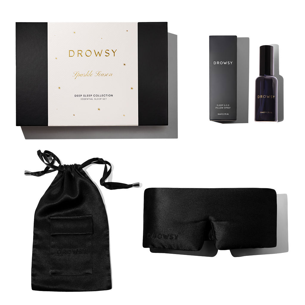 The Black Jade - Deep Sleep Collection by us.drowsysleepco is a luxury gift set with a silk sleep mask, black silk pouch, deep sleep pillow spray, and comes in a stylish black and white “Drowsy Deep Sleep Collection” box.