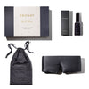 The us.drowsysleepco Moonlight Shadow - Deep Sleep Collection includes a luxury silk sleep mask, matching drawstring pouch, box, and deep sleep pillow spray with packaging—an ideal set of sleep essentials displayed on a white background.