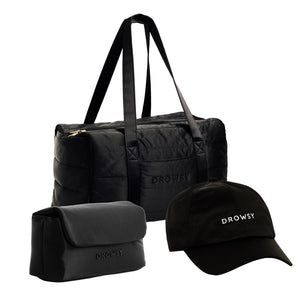 The Drowsy Weekend Collection - Black Jade features a black duffel, toiletry bag, and cap—all by Drowsy, with DROWSY embroidered in white on the duffel and cap—displayed on a white background.