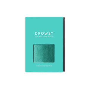 A turquoise drowsysleepco box labeled Breakfast at Drowsy Carry Pouch features a small window displaying a shiny green mulberry silk pouch inside. The box sits against a white background.