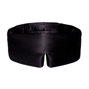 The Black Jade eye mask by drowsysleepco features a contoured black silk design with a bottom center notch for comfort, and Drowsy subtly embossed on the lower left—perfect for enhancing your beauty sleep.