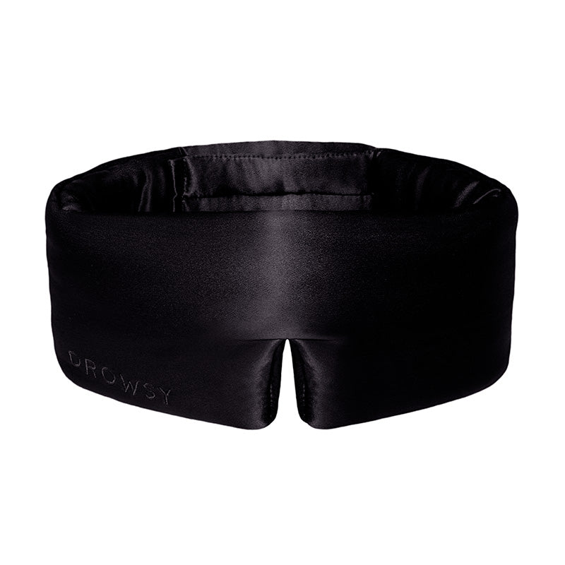 The Black Jade eye mask by drowsysleepco features a contoured black silk design with a bottom center notch for comfort, and Drowsy subtly embossed on the lower left—perfect for enhancing your beauty sleep.
