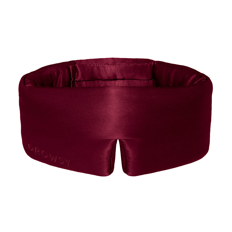La Vie En Rouge by drowsysleepco is a dark red silk eye mask with “DROWSY” embossed on the front. Its contoured shape and center notch ensure total blackout and comfortable, uninterrupted beauty sleep.