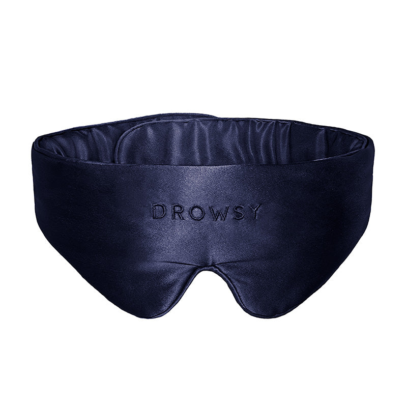 Introducing the Featherweight Silk Eye Mask in Midnight Blue by us.drowsysleepco—a luxurious, padded sleep mask crafted from mulberry silk. This dark blue eye mask is designed for ultimate comfort, with "DROWSY" elegantly embroidered on the front.