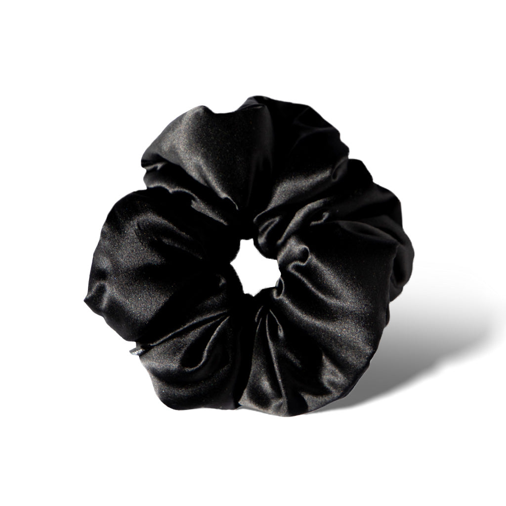 The Black Jade - Padded Scrunchie by us.drowsysleepco, an oversized shiny black silk hair accessory, is shown in a circular shape on a white background with a subtle shadow.