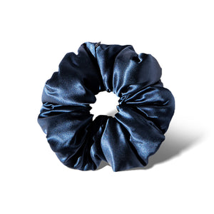 The us.drowsysleepco Midnight Blue - Padded Scrunchie, a dark blue oversized silk accessory, is shown on a white background with a soft shadow—ideal for boosting hair volume and promoting hair health.