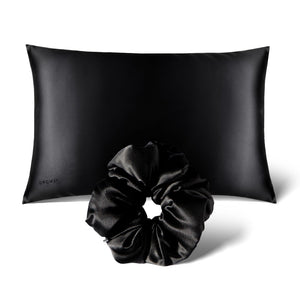 The Perfect hair bundle Black Jade by drowsysleepco features a black silk pillowcase paired with a matching silk scrunchie, both elegantly displayed against a crisp white background.