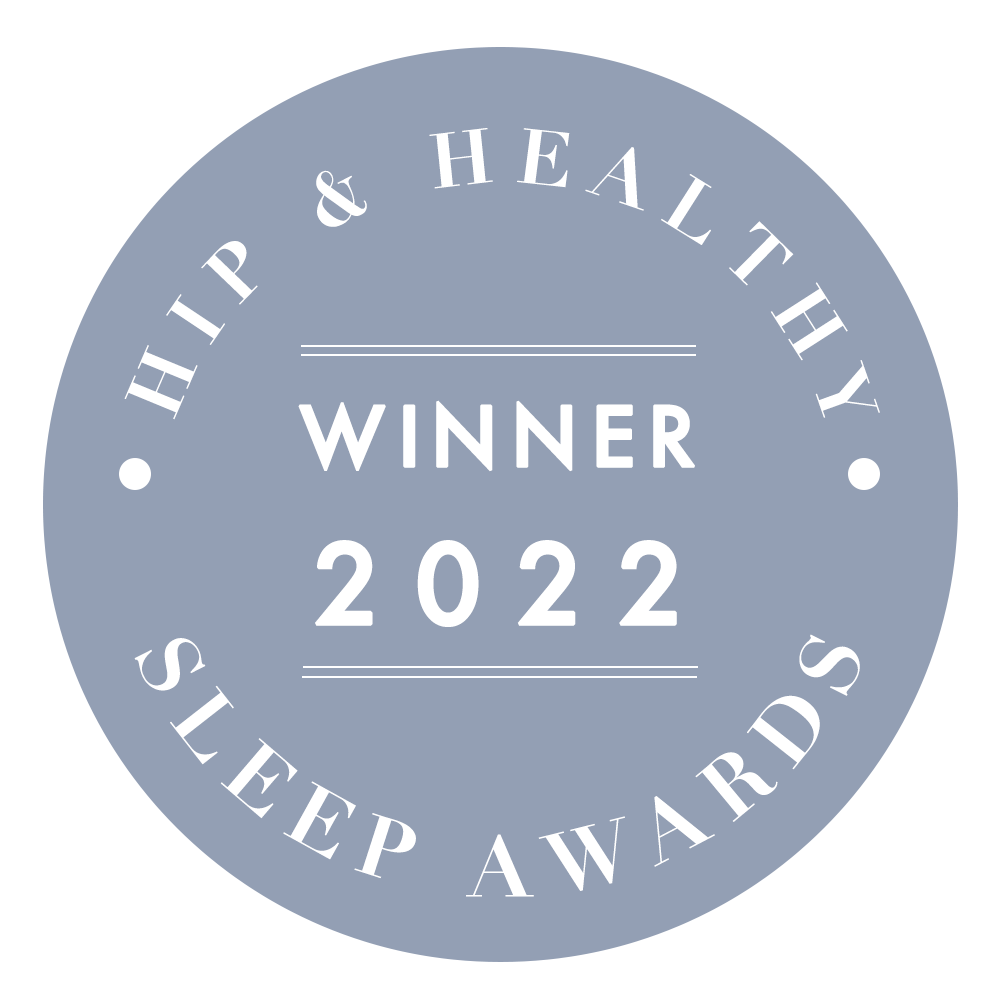 A gray circular badge with white text reads: Hip & Healthy Sleep Awards Winner 2022.