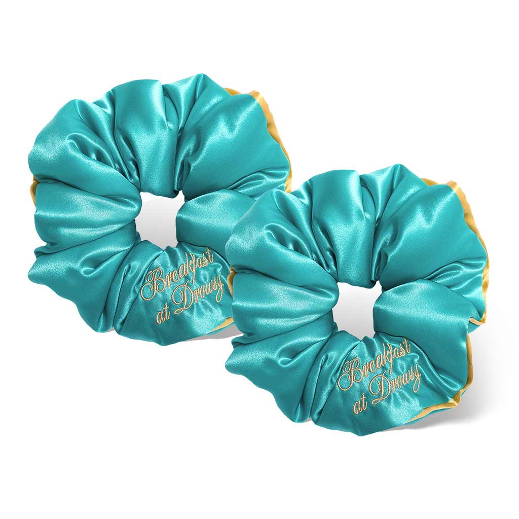 Elevate your hair game with the Breakfast at Drowsy - Turquoise Padded Scrunchie by drowsysleepco, featuring gold script embroidery—ideal for added volume or as a chic, oversized alternative to classic mulberry silk styles.