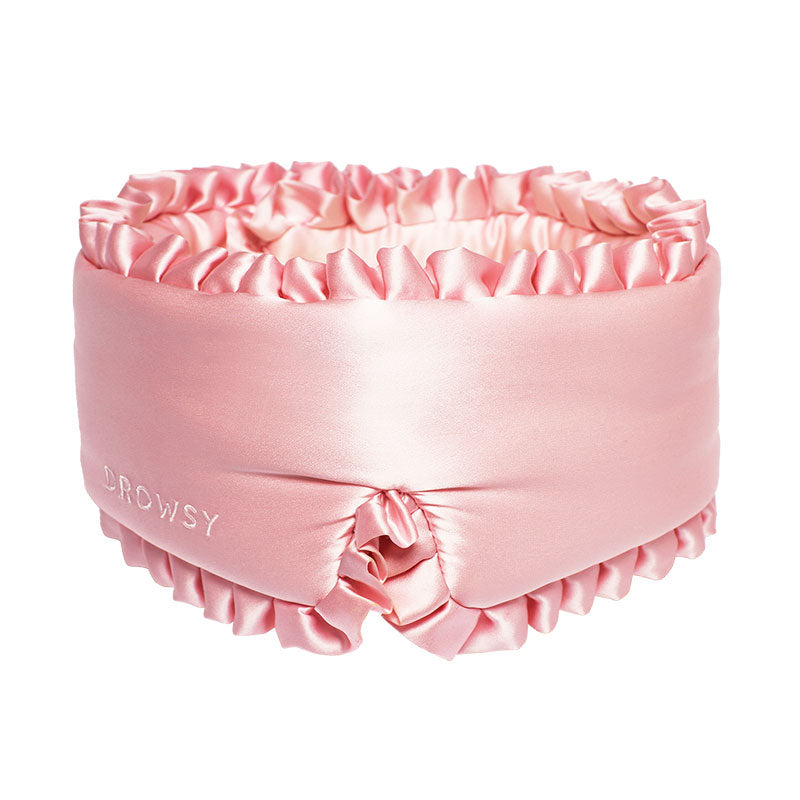 The drowsysleepco Sleep and the City Powder Pink silk sleep mask features pink ruffles and 