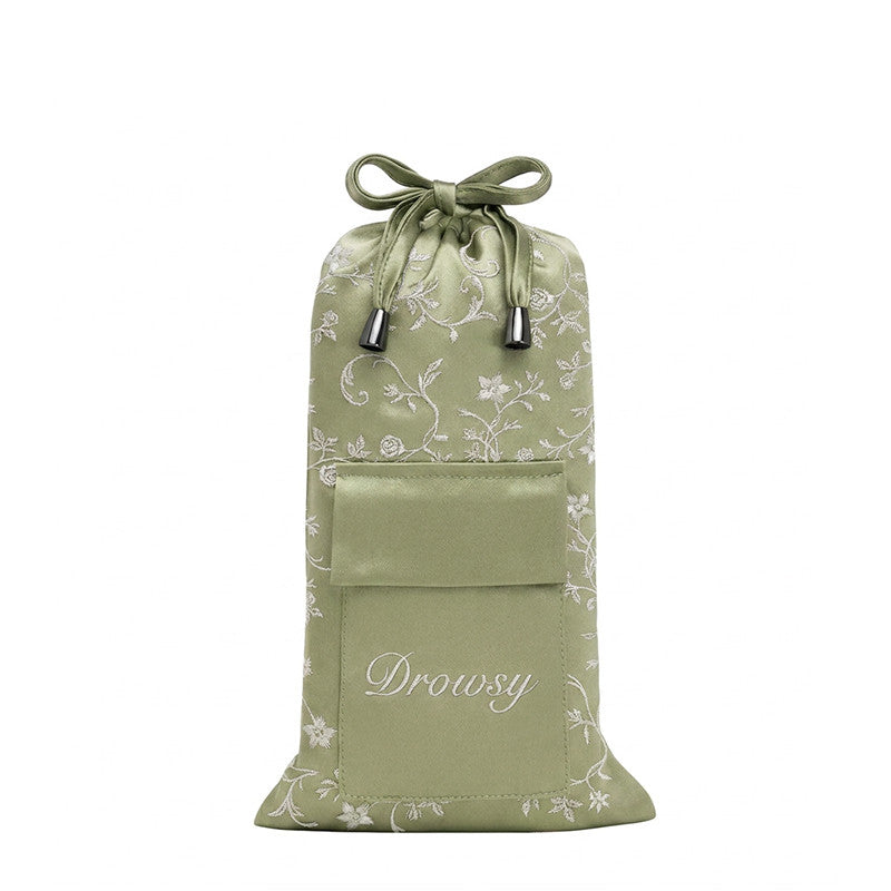 Pride & Prejudice - Sage Carry Pouch, a sage green mulberry silk drawstring pouch featuring a white floral pattern and a front pocket embroidered with the word Drowsy.